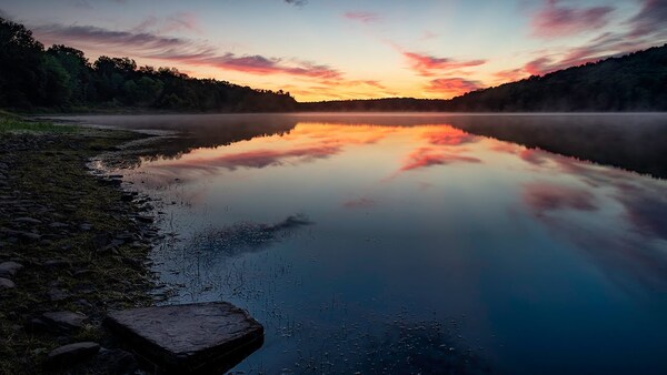 A warm sunrise over a quiet landscape